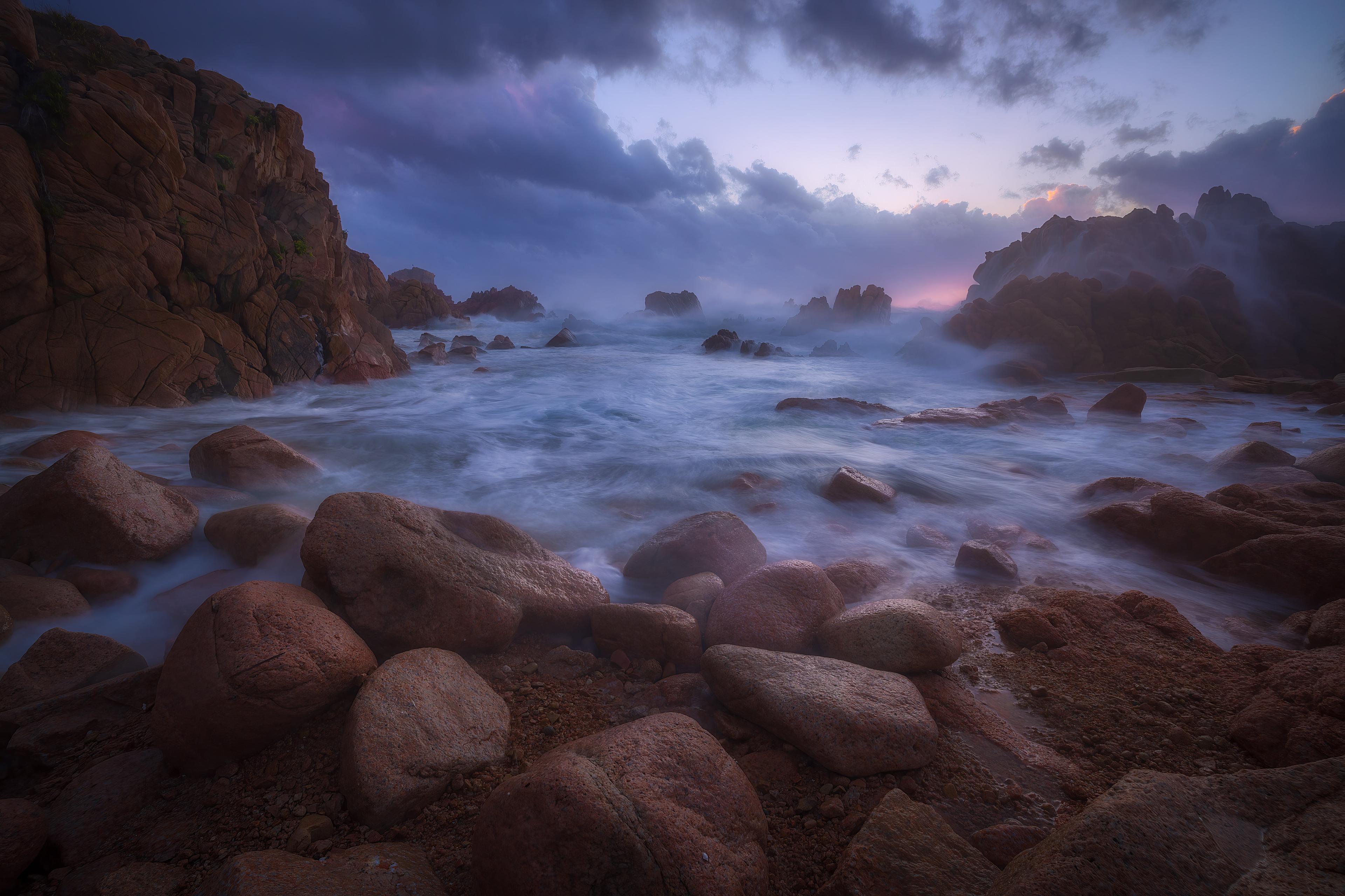 Rocky Coast Embraced by Misty Waves